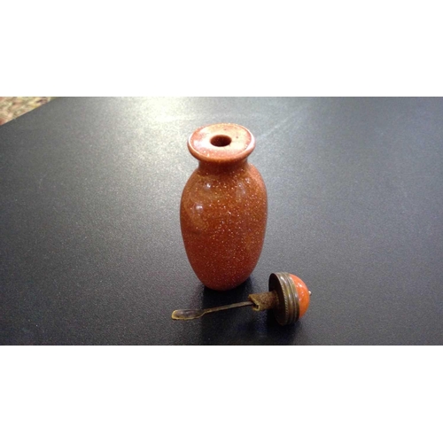 257 - A Chinese 'goldstone' snuff bottle, 19th century. With agate stopper, height 8.5cm, width 3.5cm. sma... 