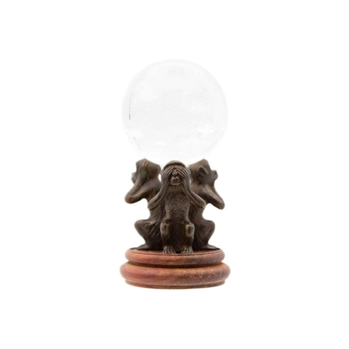 259 - A Japanese bronze of three wise monkeys, early 20th century. Holding a crystal ball, with a later wo... 