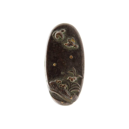 261 - A Japanese bronze tsuba, Edo period. With bronze fuichi and kashira, tsuba width 6.8cm. (3)