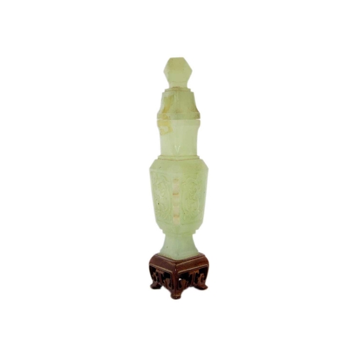 271 - A Chinese carved jade vase and cover Attached to a wooden stand, total height 19cm, width 9cm, depth... 