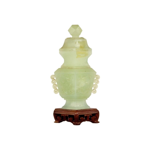 271 - A Chinese carved jade vase and cover Attached to a wooden stand, total height 19cm, width 9cm, depth... 