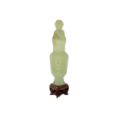 271 - A Chinese carved jade vase and cover Attached to a wooden stand, total height 19cm, width 9cm, depth... 