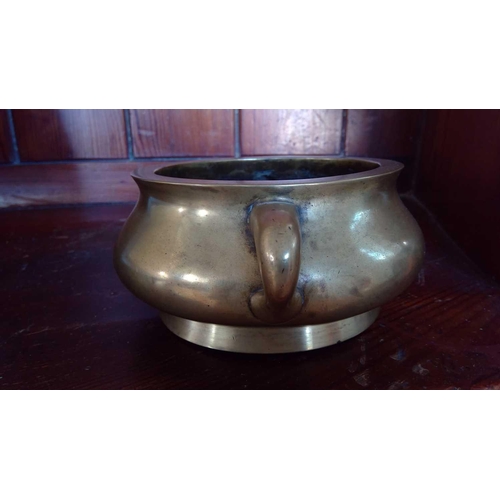 272 - A Chinese polished bronze censer, 18th/19th century. Seal mark to base, height 7.5cm, width 20cm, de... 