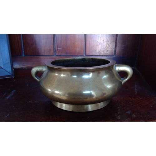 272 - A Chinese polished bronze censer, 18th/19th century. Seal mark to base, height 7.5cm, width 20cm, de... 