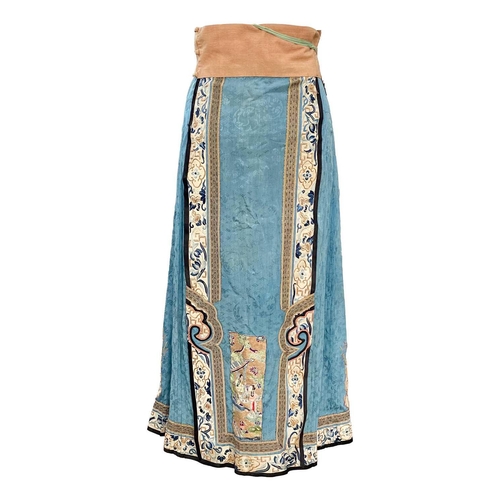 277 - A Chinese silk embroidered skirt, Qing Dynasty. Decorated with two rectangular gold metal thread and... 