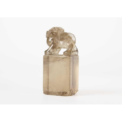 278 - A Chinese rock crystal seal, 19th century. Surmounted by a dog of fo, uncut, height 5.5cm, width 2.5... 