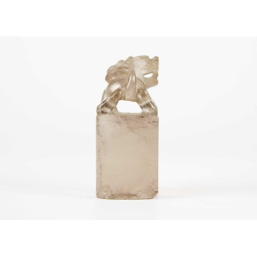 278 - A Chinese rock crystal seal, 19th century. Surmounted by a dog of fo, uncut, height 5.5cm, width 2.5... 