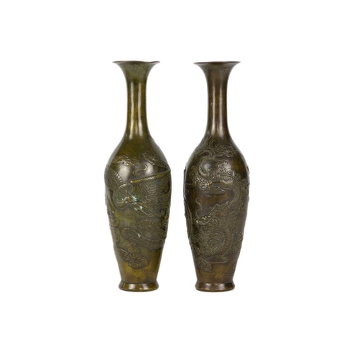 286 - A pair of Chinese bronzed vases, 20th century. Decorated in relief with dragons and cloud scrolls, s... 