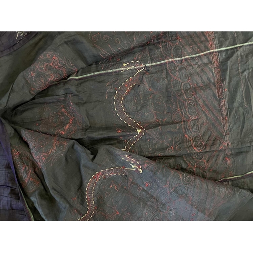 296 - A Chinese metal thread decorated cotton and silk skirt, late Qing Dynasty. Decorated with numerous d... 