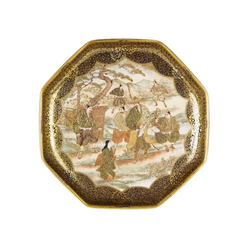 299 - A pair of Japanese Satsuma octagonal plates, Meiji period. Gilt decorated with multiple figures in a... 