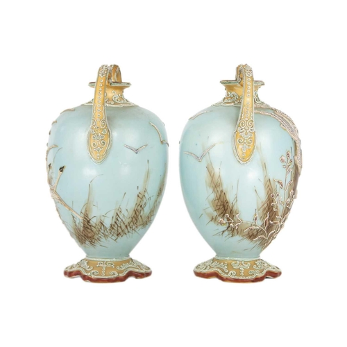 324 - A pair Japanese Noritake porcelain vases, early 20th century. Decorated in relief with geese in flig... 