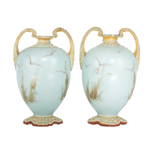 324 - A pair Japanese Noritake porcelain vases, early 20th century. Decorated in relief with geese in flig... 