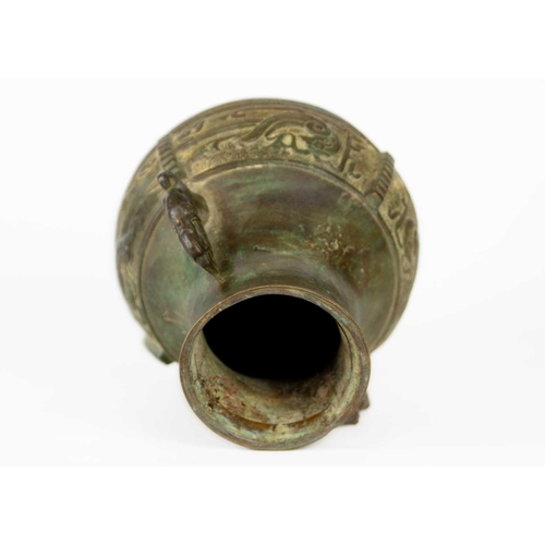 333 - A Chinese paktong opium pipe. Height 34cm, a cast iron oil lamp, height 13.5cm, a Chinese archaic st... 