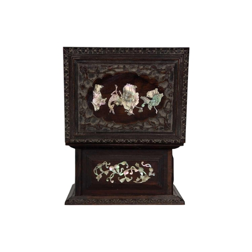 334 - A Chinese hardwood and mother of pearl jewellery casket, late Qing Dynasty. The interior with a lift... 