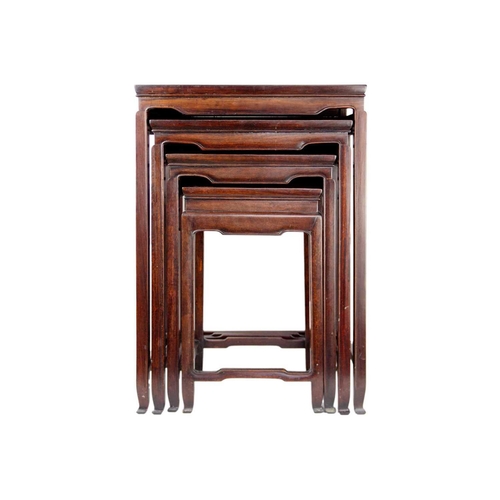 34 - A Chinese hardwood nest of four tables, early 20th century. Height 70cm, width 49cm, depth 35cm. The... 