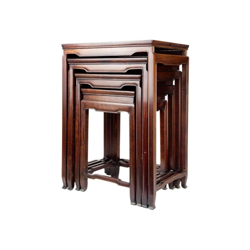 34 - A Chinese hardwood nest of four tables, early 20th century. Height 70cm, width 49cm, depth 35cm. The... 