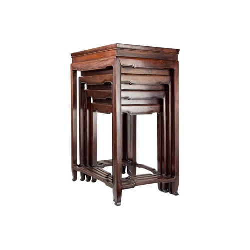 34 - A Chinese hardwood nest of four tables, early 20th century. Height 70cm, width 49cm, depth 35cm. The... 