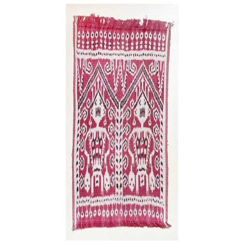 348 - An Indonesian Ikat, mounted on card. 82.5 x 38cm.