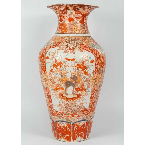 4 - A Japanese Imari porcelain floor standing vase, 19th century. The opposing panels filled with a dog ... 