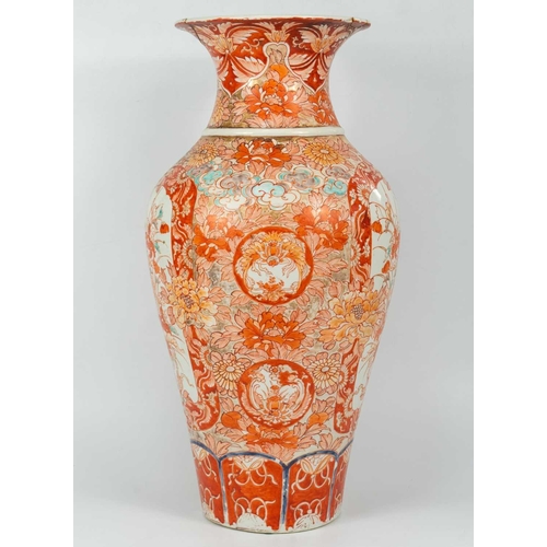 4 - A Japanese Imari porcelain floor standing vase, 19th century. The opposing panels filled with a dog ... 