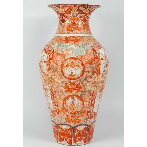 4 - A Japanese Imari porcelain floor standing vase, 19th century. The opposing panels filled with a dog ... 