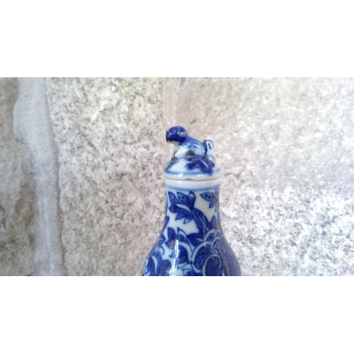 49 - A Chinese blue and white gourd vase, 19th century. Height 16.5cm, width 7.5cm. The cover has been gl... 