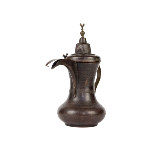 55 - A Saudi Arabian copper dallah pot, early-mid 20th century. Signed, height 30.5cm, width 27cm.