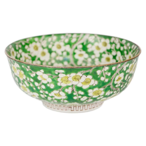 57 - A Japanese porcelain prunus pattern bowl, Meiji period. With a green ground, height 9cm, diameter 21... 