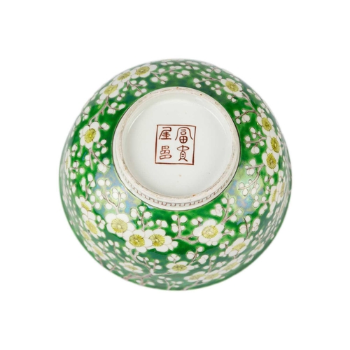 57 - A Japanese porcelain prunus pattern bowl, Meiji period. With a green ground, height 9cm, diameter 21... 