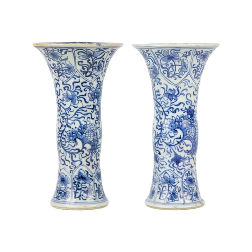 59 - A pair of Chinese blue and white gu vases, Kangxi period. Restored, height 20cm, diameter 11cm. (2) ... 