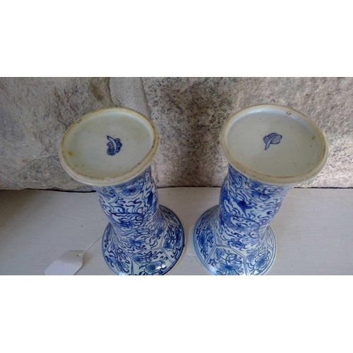 59 - A pair of Chinese blue and white gu vases, Kangxi period. Restored, height 20cm, diameter 11cm. (2) ... 