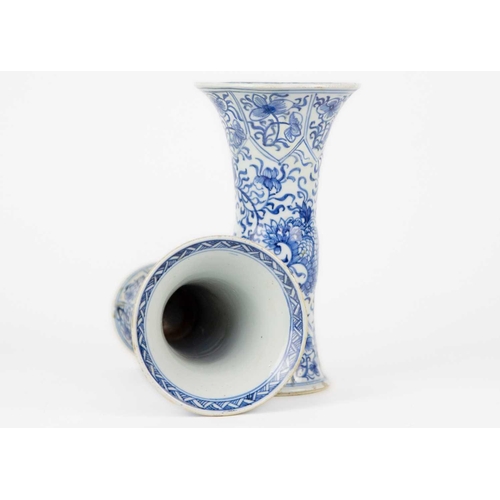 59 - A pair of Chinese blue and white gu vases, Kangxi period. Restored, height 20cm, diameter 11cm. (2) ... 