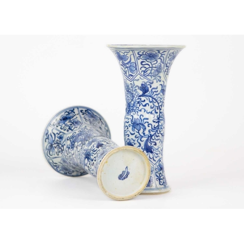 59 - A pair of Chinese blue and white gu vases, Kangxi period. Restored, height 20cm, diameter 11cm. (2) ... 