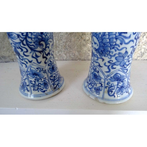 59 - A pair of Chinese blue and white gu vases, Kangxi period. Restored, height 20cm, diameter 11cm. (2) ... 