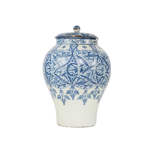 60 - A Moroccan blue and white pottery lidded khabia jar, 19th century. Height 44cm, width 27.5cm. chips ... 