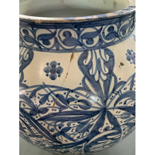 60 - A Moroccan blue and white pottery lidded khabia jar, 19th century. Height 44cm, width 27.5cm. chips ... 