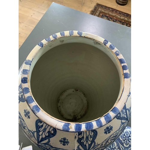 60 - A Moroccan blue and white pottery lidded khabia jar, 19th century. Height 44cm, width 27.5cm. chips ... 