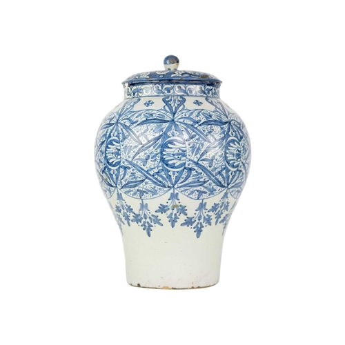 60 - A Moroccan blue and white pottery lidded khabia jar, 19th century. Height 44cm, width 27.5cm. chips ... 