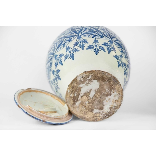 60 - A Moroccan blue and white pottery lidded khabia jar, 19th century. Height 44cm, width 27.5cm. chips ... 