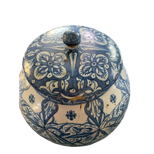 60 - A Moroccan blue and white pottery lidded khabia jar, 19th century. Height 44cm, width 27.5cm. chips ... 