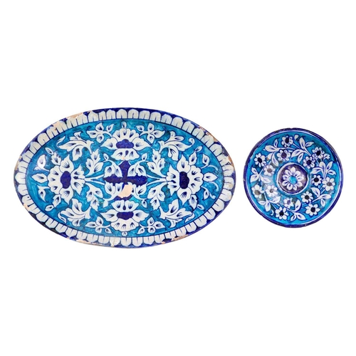 68 - Two Multan pottery dishes, Sindh, Pakistan. Late 19th century, 20 x 31cm and 14.5cm diameter. (2)