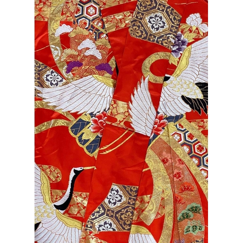 71 - A Japanese silk and metal thread Kimono, 20th century. Length 200cm.