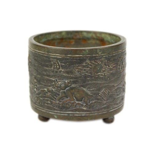 73 - A Chinese bronze incense burner, Qing Dynasty. The cylindrical body decorated with buffaloes in a la... 