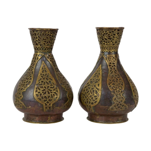 74 - A pair of Persian copper vases, 19th century. With overlaid brass tendrils, height 18.5cm, width 11c... 