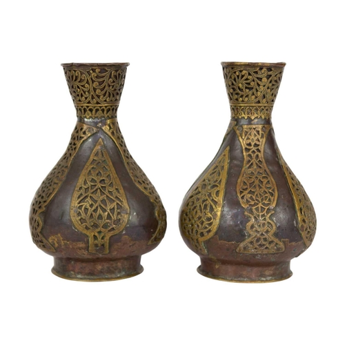 74 - A pair of Persian copper vases, 19th century. With overlaid brass tendrils, height 18.5cm, width 11c... 