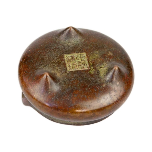 8 - A Chinese bronze censer. With seal mark, height 4.5cm, width 9cm and a Chinese brass pipe, length 32... 