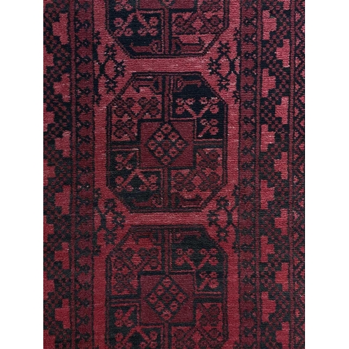 82 - An Afghan runner. With seven large octagonal medallions, 292 x 78cm and an Afghan rug, 129 x 88cm. (... 