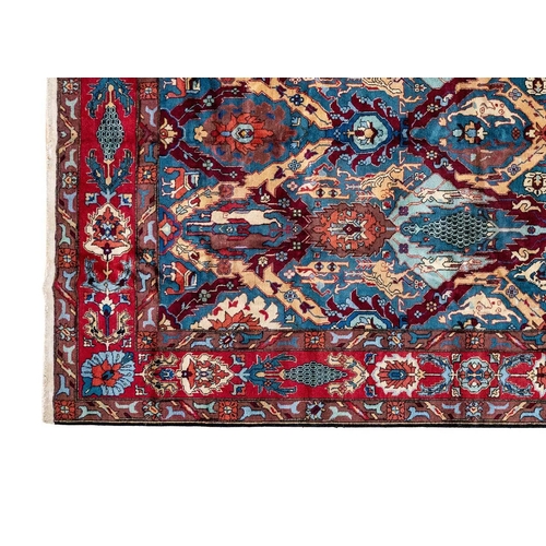 86 - An Isparta carpet, South West Anatolia. The blue field with polychrome trellis design and stylised b... 