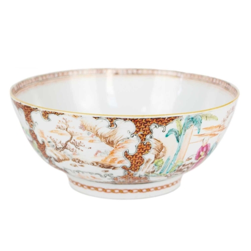 9 - A Chinese porcelain punch bowl, Qianlong period. Painted in the Mandarin palette and decorated with ... 