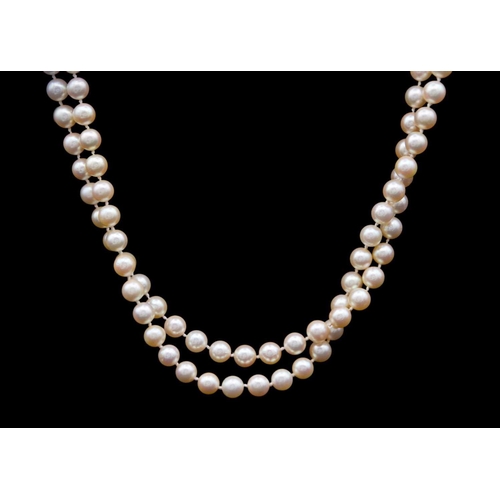 101 - A double-row cultured pearl Opera length necklace, 9ct white gold diamond & sapphire set clasp The 1... 